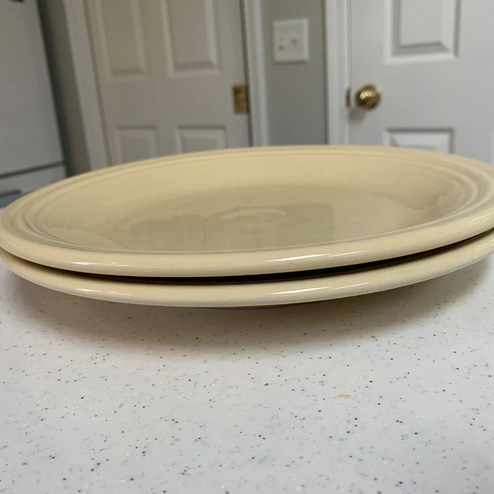 Two Fiesta Ivory Dinner Plates